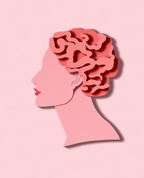 An illustration of a woman's head with a pink paper brain cut-out