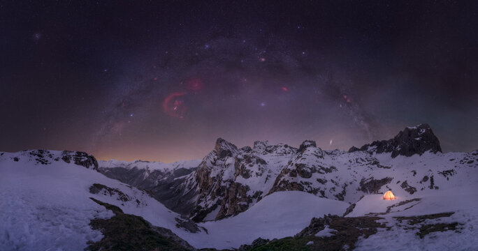 Illuminated Tent with milky way At Night in High Mountains