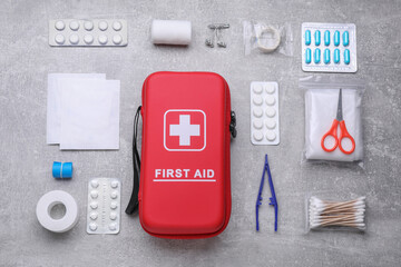 Flat lay composition with first aid kit on light gray background