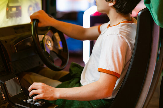 Teenager Plays On Gaming Machine Simulators Car