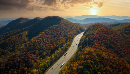 I-40 freeway road leading to Asheville in North Carolina over Appalachian mountain pass with yellow...