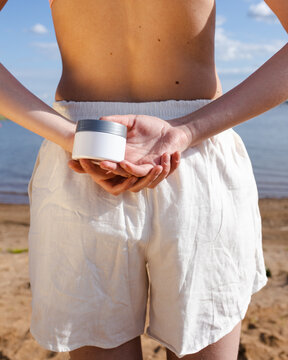 Body skincare routine on the beach in summer