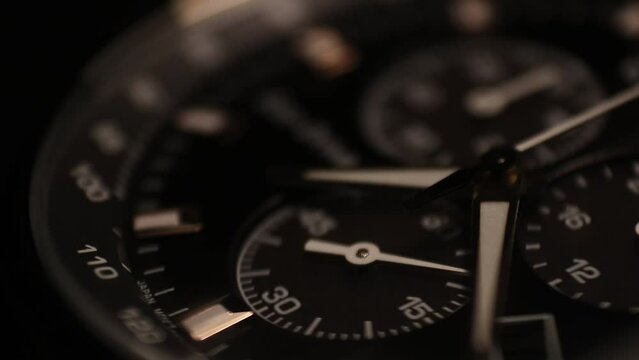 Close-up Macro shot of Watch face passing through 40 seconds. Great Detail, dark watch dial