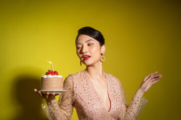 Positive woman celebrating anniversary dressed in stylish dress