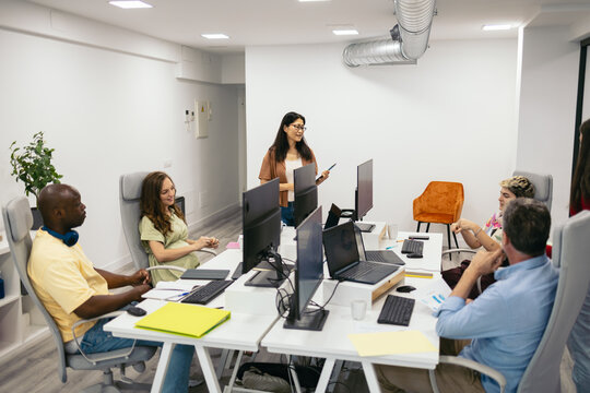 Office Colleagues Working In A Coworking Space With Computers