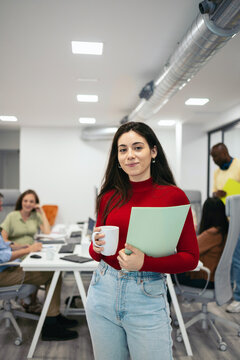 Portrait Of Smiling Young Businesswoman In Office