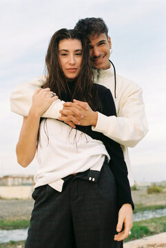Young and modern couple at sunset