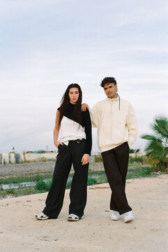 Young and modern couple at sunset