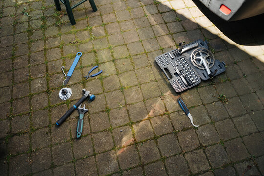 Set of various tools lies in the backyard