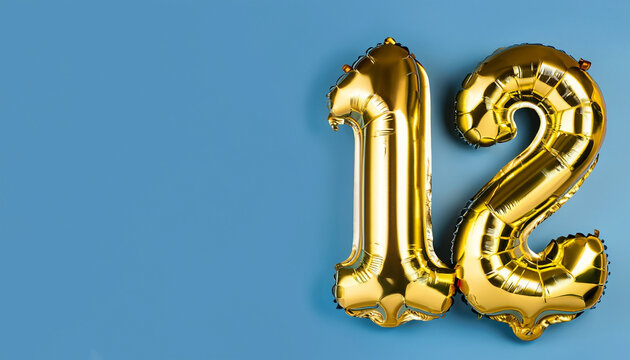Banner with number 12 golden balloon with copy space. Twelve years anniversary celebration concept on a blue background.