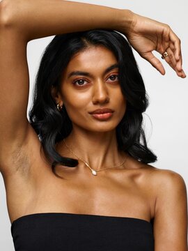 Sensual woman wearing golden jewelry