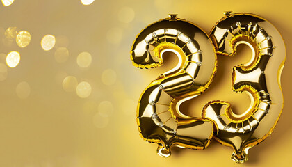 Banner with number 23 golden balloons with copy space. Twenty-three years anniversary celebration...