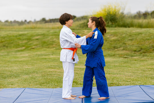 Teen friends judo practice outdoor