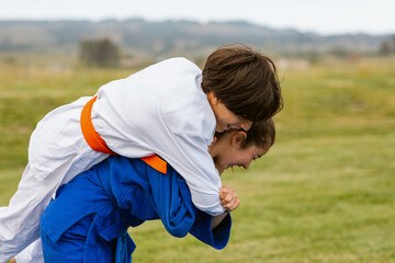 Friends practicing judo in nature