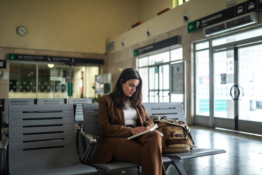 woman waiting at train station