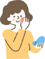 鏡を見ながら化粧をしている女性_色