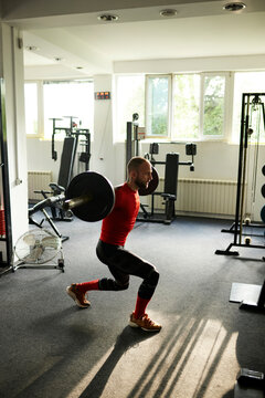 Athlete exercises with a weight