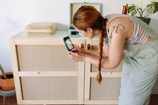 Woman taking a photo of her DIY