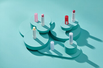 Set of open lipsticks displayed on colorful background
