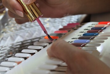 Girl prepares colors for manicure