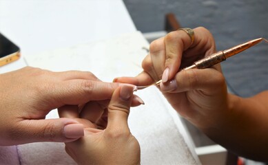 The girl draws with a brush on the niht