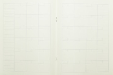 top view image of open planner notebook with blank page, lined paper texture background