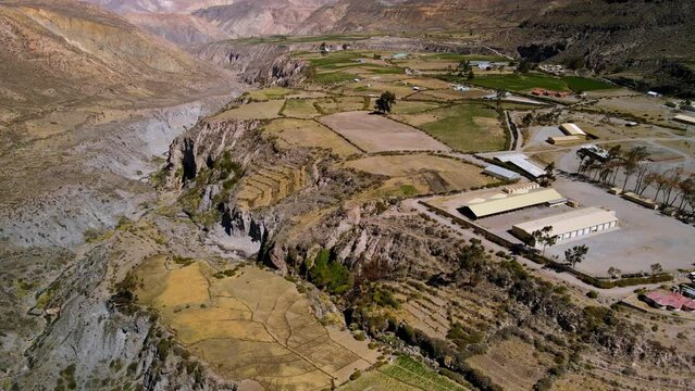 Aerial view of a village in the altiplano, sunny evening, Putre,  Chile - reveal , drone shot