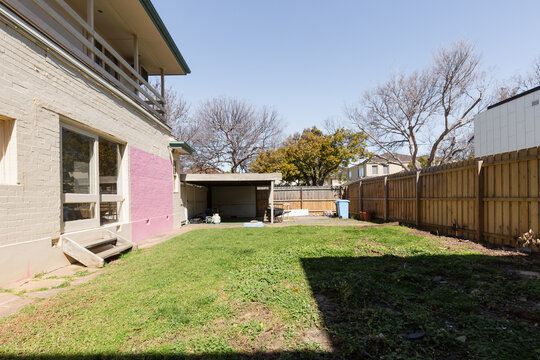 Before image of a backyard ready for a home extension