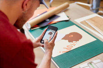 Crop artist shooting paper poster