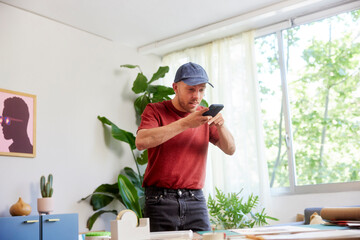 Artist shooting paper craft on table