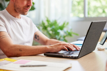 Man working on wireless laptop