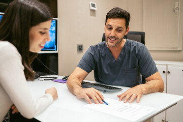 Dentist offering a dental treatment to a young woman