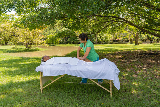 Masseuse working outdoors. 