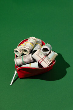 US dollars in red purse, cash, banknotes, money