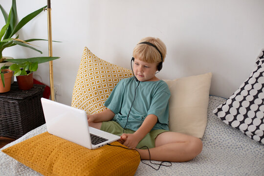 blonde boy with laptop