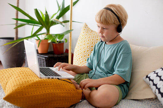 blonde boy with laptop