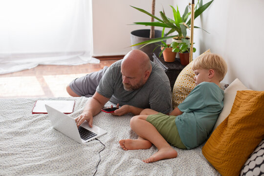 father and son with laptop