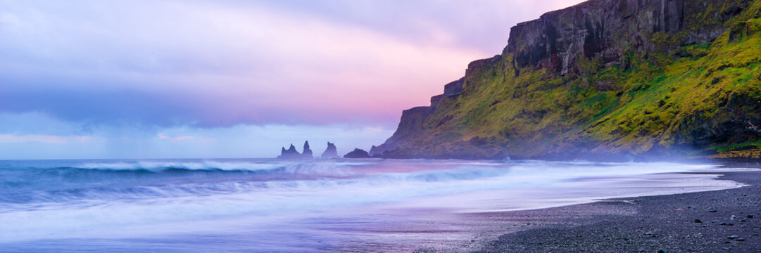 Sunset on rugged Iceland beach at the town of Vic