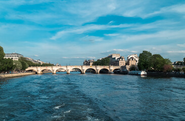 Fototapeta na wymiar Paris, France. April 22, 2022: Neuf bridge and Seine river view.