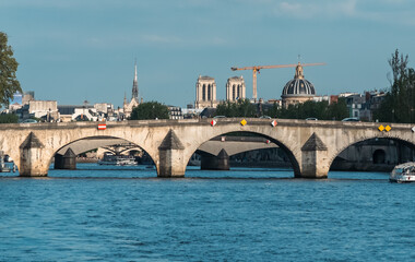 Fototapeta na wymiar Paris, France. April 22, 2022: Neuf bridge and Seine river view.
