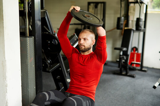 Portrait of a disabled athlete exercising on a sit-up bench