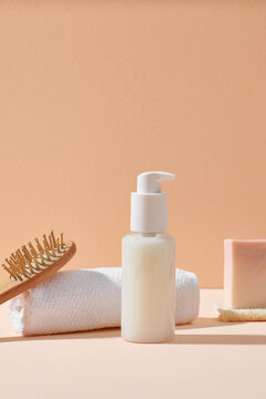 Cosmetic white glass bottle on grange natural stone and wooden
