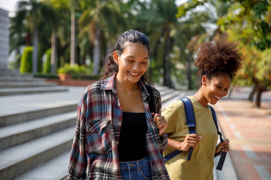 High school girl students having fun conversation at college campus