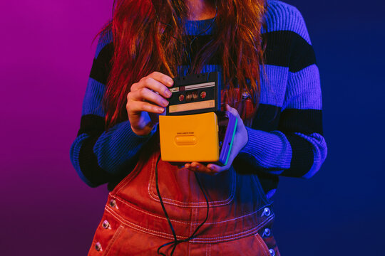Woman using a cassette player