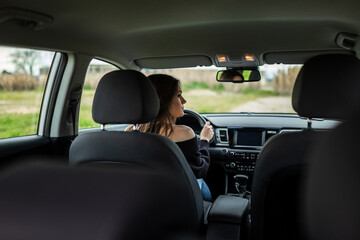young woman driving a car