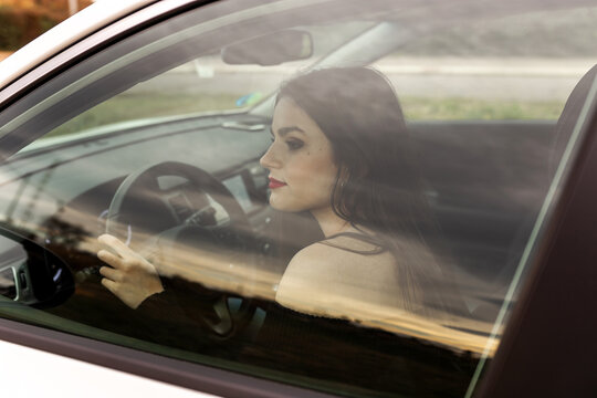 young woman driving a car