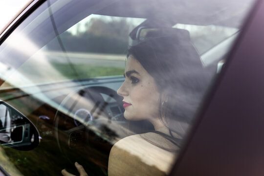 young woman driving a car