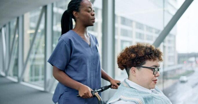 Nurse, woman and help with wheelchair in corridor, hospital or happy for talking, kindness or helping hand. Doctor, medical support and caregiver for person with disability, chat or patient in clinic