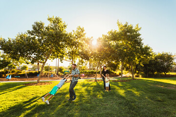 Young family in park.