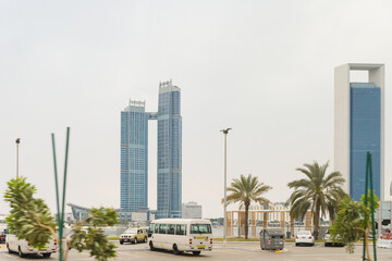 View from the window of a tourist bus on the architecture of the city of Abu Dhabi, United Arab Emirates